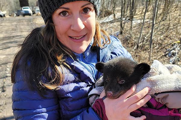 Haley Sankey joined biologists from the Pennsylvania Game Commission when they checked on the health of a mother black bear and her cubs at a den in Central Pennsylvania